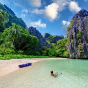 Young Woman Swimming On A Beach In Palawan, Philippines, Southeast Asia